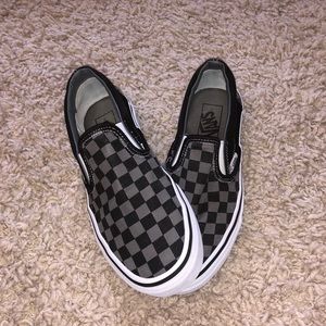 Black and grey checkered slip on Vans